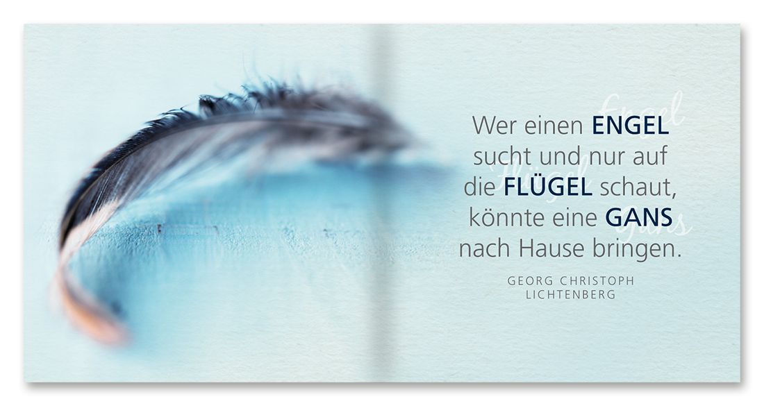 Schutzengel-Figur und Buch in einer Box